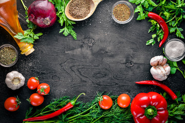 Big set organic food. Fresh raw vegetables. On a black chalkboard.