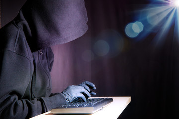 A hacker in his illegal work