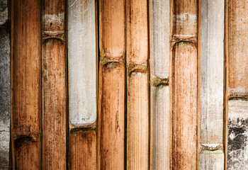 Split bamboo stalk fence. Bamboo wall.