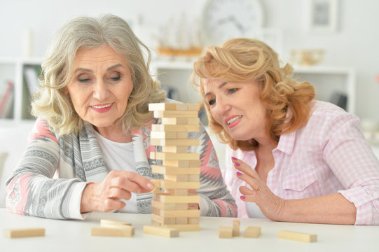 Elderly People Playing A Board Game