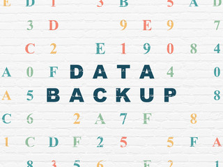 Information concept: Data Backup on wall background