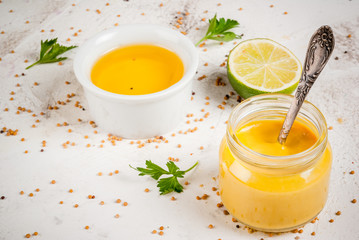 Ingredients for cooking healthy light dressings for vegetable salad: lemon (lime), olive oil,...