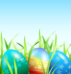 Vector background with Easter eggs in the grass