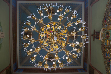 Large gold chandelier in the Church