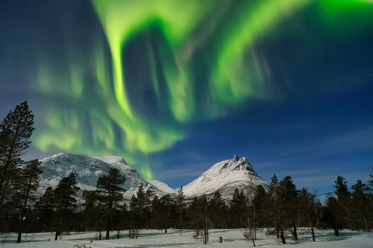 Northern lights over the mountains peak