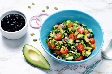 Black beans corn avocado red onion tomato salad with lime dressing
