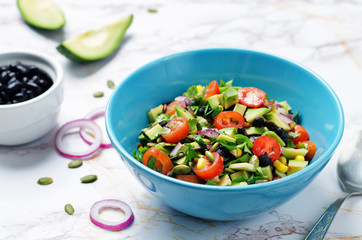 Black beans corn avocado red onion tomato salad with lime dressing