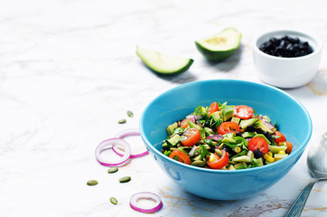 Black beans corn avocado red onion tomato salad with lime dressing