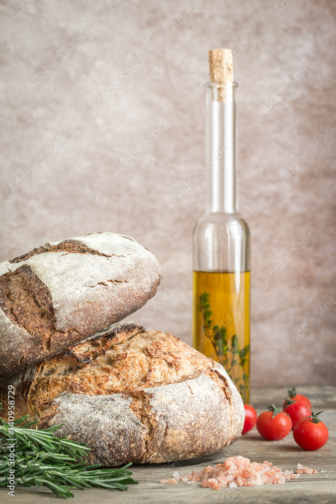 Canvas Prints Loaves of bread with cherry tomatoes and fresh rosemary