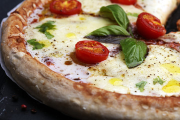 Hot true PEPPERONI ITALIAN PIZZA with salami and cheese. TOP VIEW Tasty traditional pepperoni pizza on board on wooden table with decoration