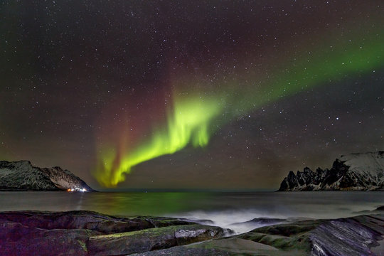 Aurora borealis (Polar lights). View to Steinfjord on Senja island (Oksan on Background) - Norway