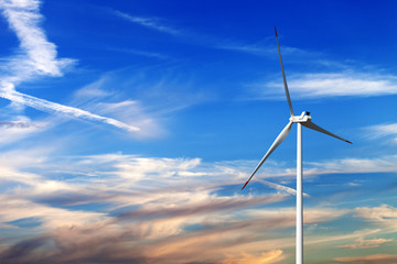 Fototapeta premium Wind turbine and multicolor sunrise sky