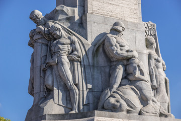 Fototapeta na wymiar Statues on the Freedom Monument in Riga city, Latvia