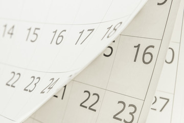 Closeup of dates 16 on calendar page