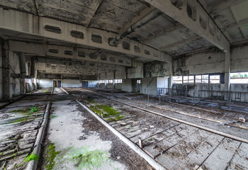 Fototapeta na wymiar Inside the building of former Soviet collective farm in abandoned Masheve settlement, Chernobyl Exclusion Zone, Ukraine