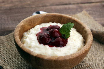 Milk rice pudding with hot cherries