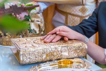 engagement rings at the hands of the newlyweds