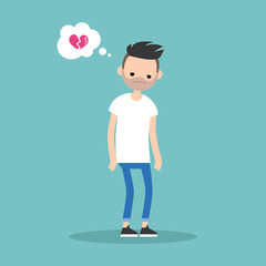 Unrequited love concept young bearded man with a broken heart