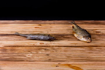 Dried fish on wooden table