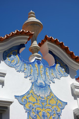 portugal, azulejos on house, detail rooftop