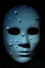 Textured mask with rain drops painted surface, neutral expression on dark background.