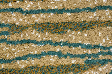 colorful texture with different colored horizontal stripes containing a mosaic of interwoven wool fibers zoom on full frame