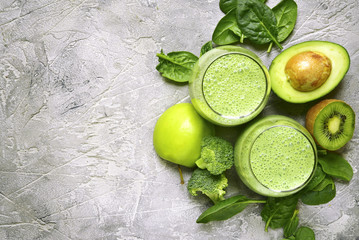 Green smoothie with avocado,broccoli,spinach,kiwi and apple.Top view with copy space.