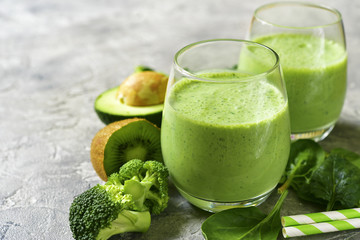 Green smoothie with avocado,broccoli,spinach,kiwi and apple.