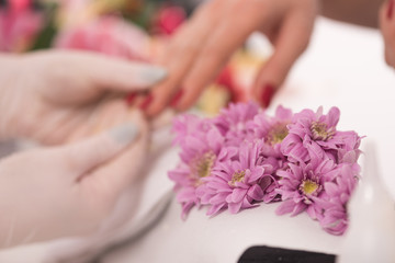 Woman hands receiving a manicure