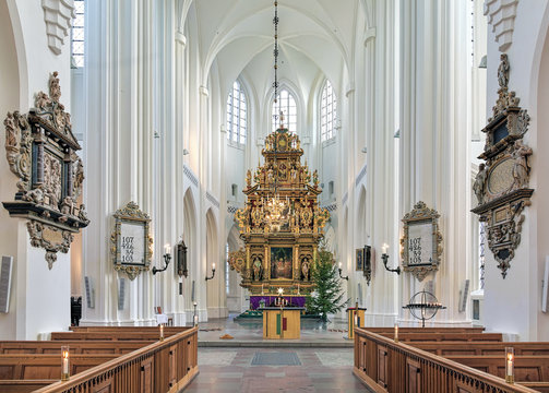 Chancel and altar of St. Peter's Church (Sankt Petri kyrka) in Malmo, Sweden. The altar, which was completed in 1611, is the largest wooden altar in northern Europe.