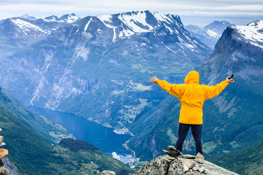 Tourist man on Dalsnibba viewpoint Norway