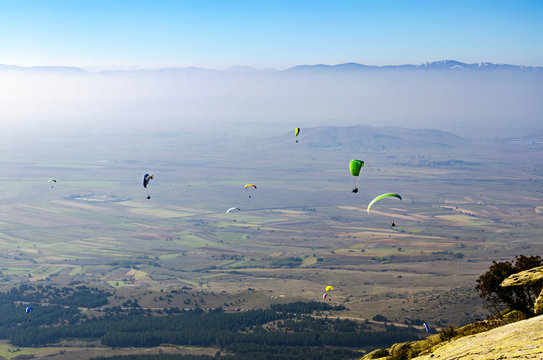 Paraglider. Parachuter. Paragliding in mountains