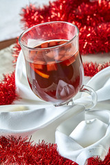 Hot mulled wine in a glass cup