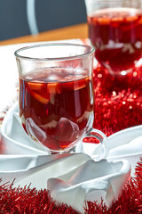 Hot mulled wine in a glass cup