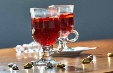 Hot mulled wine in a glass cup