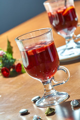 Hot mulled wine in a glass cup