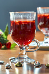 Hot mulled wine in a glass cup