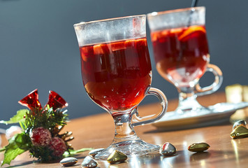 Hot mulled wine in a glass cup