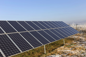 Solar Power Station in the snowy freeze winter Nature 