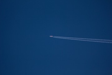 Airplane on the blue sky for background. 