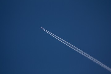 Airplane on the blue sky. 