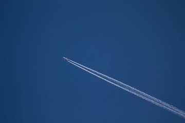 Airplane on the blue sky. 