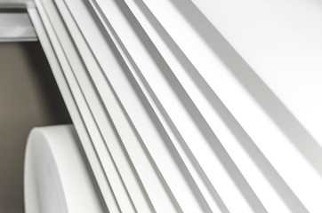 Roto paper layers in offset Printing machine, selective focus detail copyspace