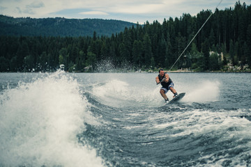 Wakesurfing on a lake in summer - McCall, Idaho