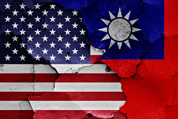 flags of USA and Taiwan painted on cracked wall