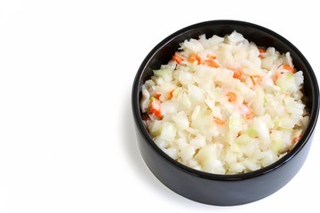 Coleslaw Salad in Black Bowl on White Background