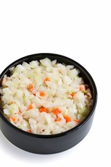 Coleslaw Salad in Black Bowl on White Background