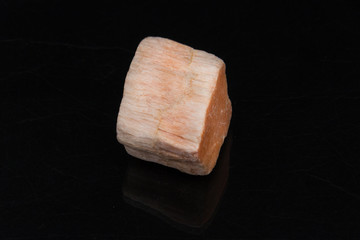 Rhodonite on black background from personal collection of Semi-precious stones and minerals
