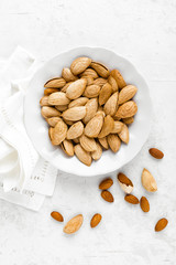 Almond nuts on white background directly above flat lay