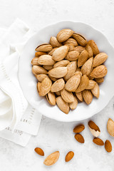 Almond nuts on white background directly above flat lay